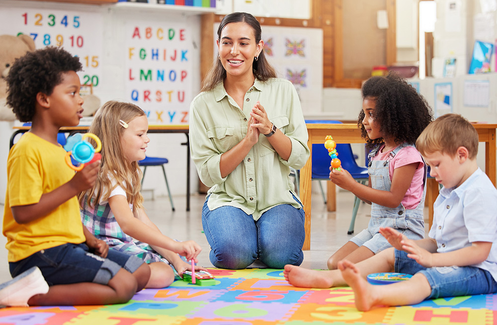 Teacher reading to young students.